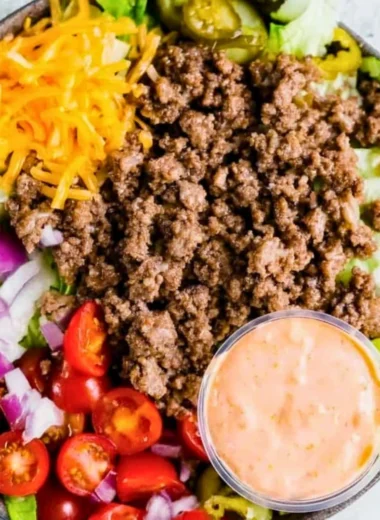 Healthy burger bowl with fresh vegetables and lean protein