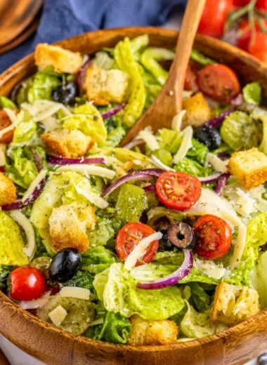 A bright and colorful Simple Italian Salad with fresh vegetables and dressing.
