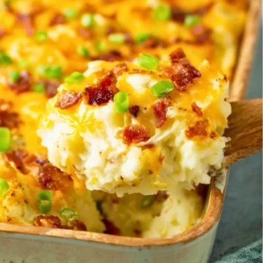 Twice Baked Potato Casserole with cheese and toppings ready for serving