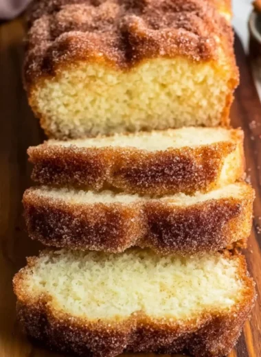 Freshly baked Cinnamon Sugar Donut Bread with a golden crust and sprinkle of sugar.