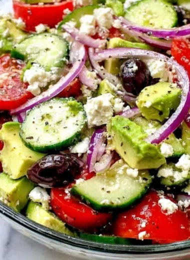 Delicious Greek Salad with Avocado, tomatoes, cucumbers, and feta cheese