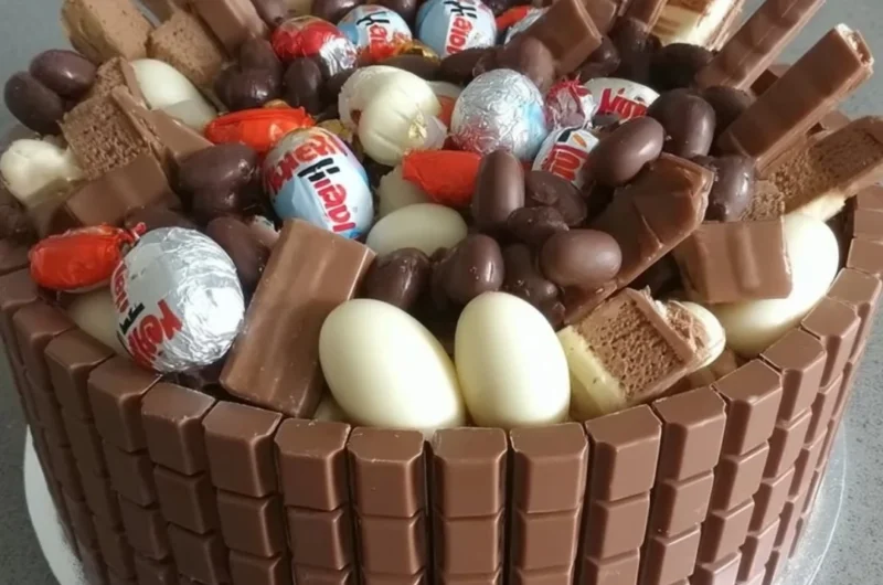 No-Bake Kinder Chocolate Cake displayed with chocolate frosting and Kinder bars