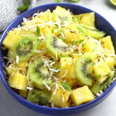 Fresh pineapple kiwi salad served in a bowl with vibrant colors and textures