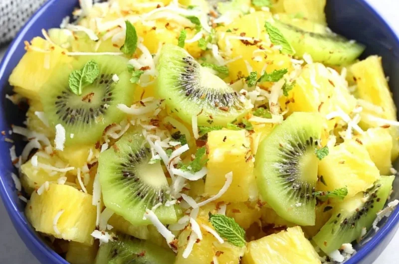 Fresh pineapple kiwi salad served in a bowl with vibrant colors and textures
