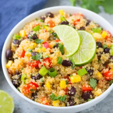 A vibrant Southwest quinoa salad with black beans, corn, and fresh vegetables.