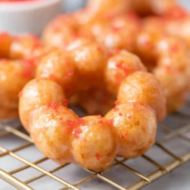 Sweet gluten-free mochi donuts on a plate, perfect for a gluten-free treat