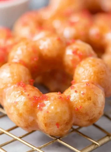 Sweet gluten-free mochi donuts on a plate, perfect for a gluten-free treat