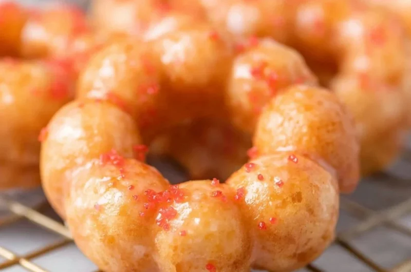 Sweet gluten-free mochi donuts on a plate, perfect for a gluten-free treat