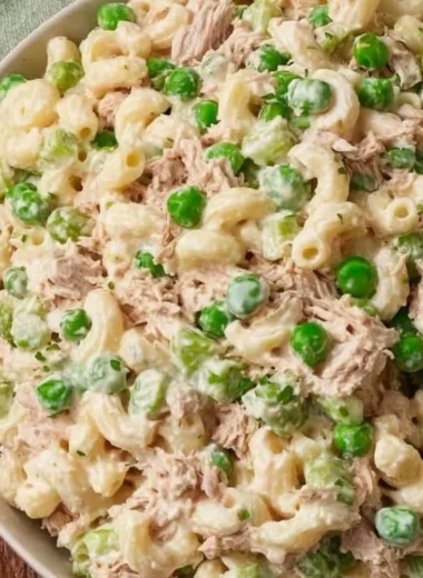 Delicious and fresh tuna pasta salad in a bowl with colorful vegetables.