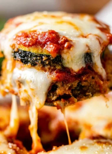 Baked Zucchini Parmesan with golden melted cheese and herbs