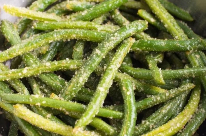Air Fryer Parmesan Green Beans garnished with parmesan cheese and herbs