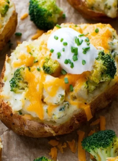 Broccoli and Cheddar Twice-Baked Potatoes topped with cheese and broccoli