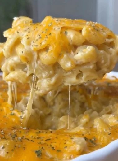 Delicious Buffalo Mac and Cheese topped with spicy sauce and melted cheese
