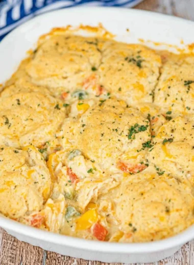 Cheddar Bay Chicken Pot Pie Casserole served in a cozy dish with herbs and cheese.