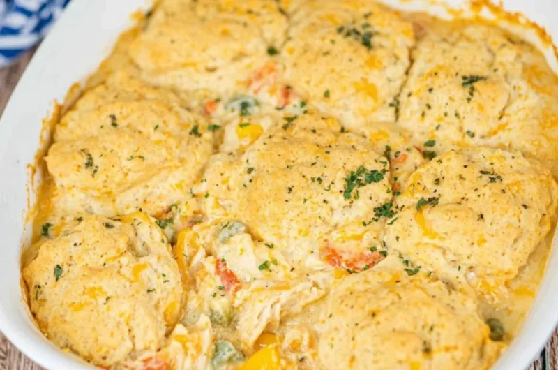 Cheddar Bay Chicken Pot Pie Casserole served in a cozy dish with herbs and cheese.