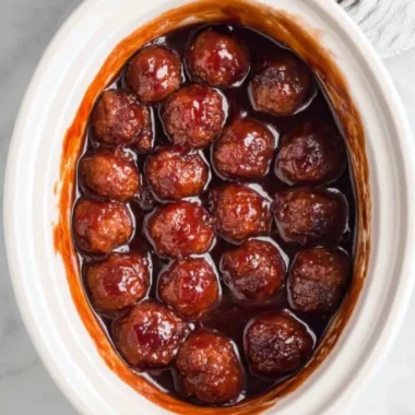 Crockpot BBQ Grape Jelly Meatballs served in a slow cooker