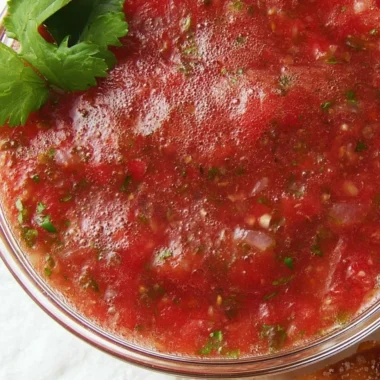 Bowl of easy homemade salsa made with fresh tomatoes, onions, and spices