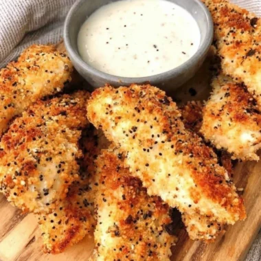 Delicious Everything Bagel Chicken Tenders served with dipping sauce