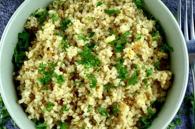 Delicious garlic butter quinoa served in a bowl with herbs