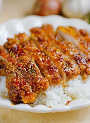Honey garlic crispy chicken served with a side of vegetables