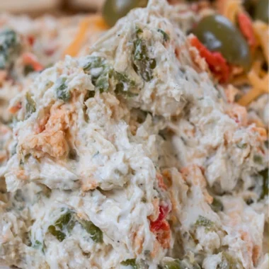 Delicious homemade olive dip served with fresh vegetables and crackers