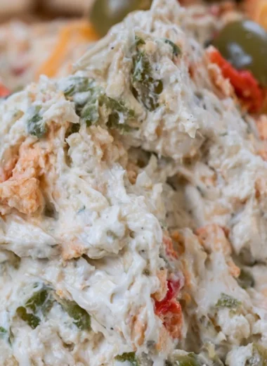 Delicious homemade olive dip served with fresh vegetables and crackers