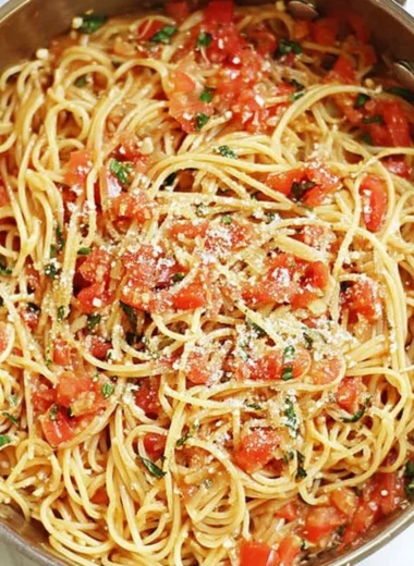 Delicious One Pot Pasta meal served in a bowl with fresh herbs and vegetables.