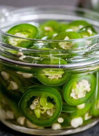 A jar of quick pickled jalapeños ready to spice up meals.