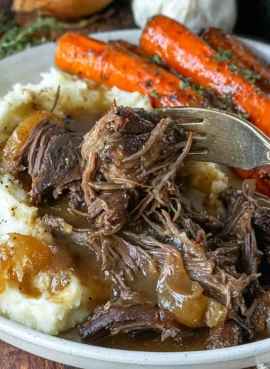 Delicious slow cooker classic pot roast served with vegetables on a rustic table.
