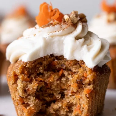 Delicious carrot cake cupcakes topped with cream cheese frosting