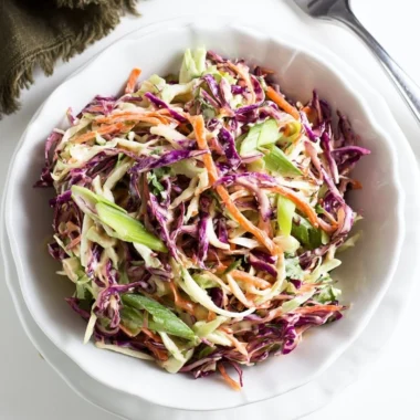 Delicious coleslaw served with pulled pork sandwiches