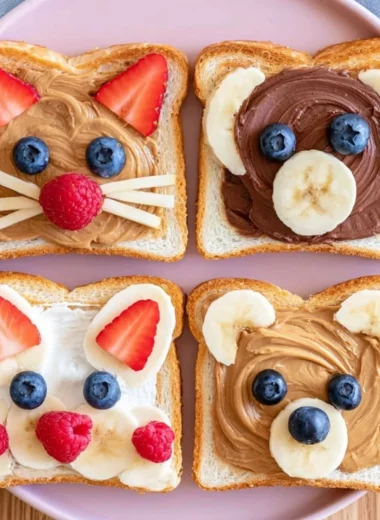 Cute animal face toast decorated with fruits and spreads.