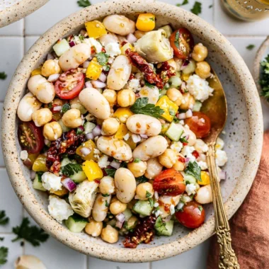 Colorful dense bean salad with a variety of beans and fresh vegetables