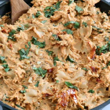 Delicious plate of Marry Me Chicken Pasta garnished with herbs