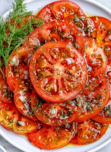 Fresh ingredients in a simple tomato salad with herbs and dressing