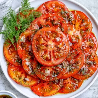 Fresh and colorful simple tomato salad with herbs and dressing